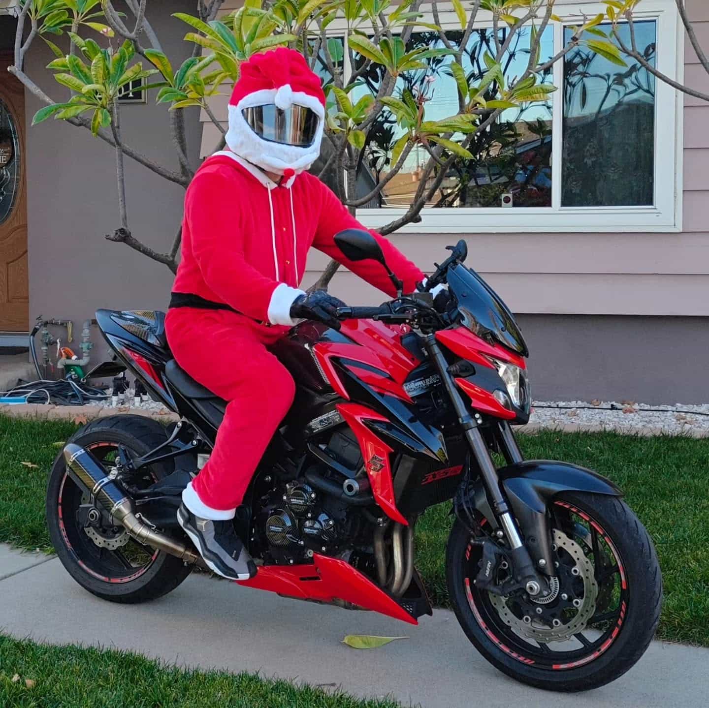 Pastor Jonathan Woods dressed as Santa Claus on a motorcycle.